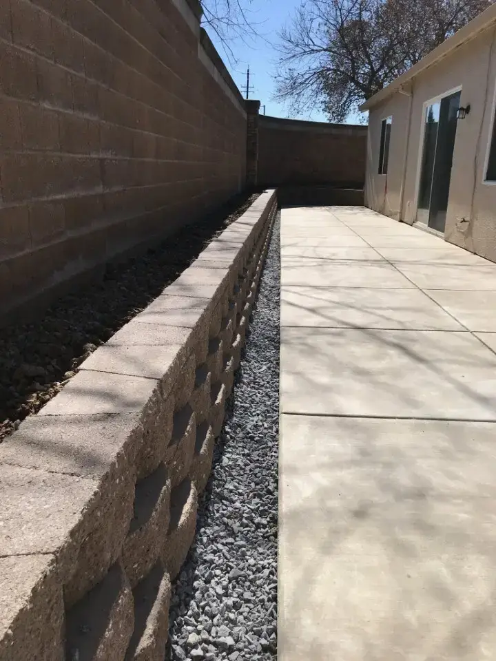 Backyard retaining wall with terraced planting