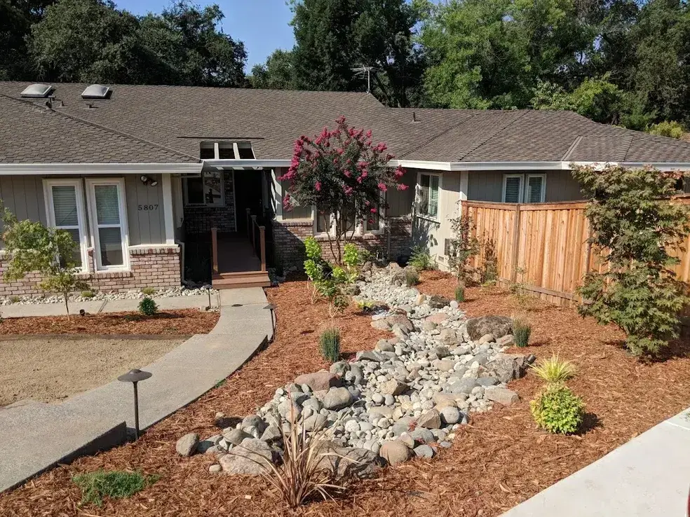 Front lawn landscaping with sod and mulched beds