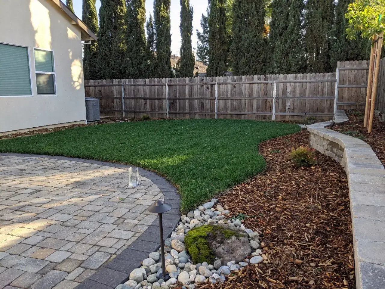 Backyard landscape design with planter beds and walkway in El Dorado Hills, CA